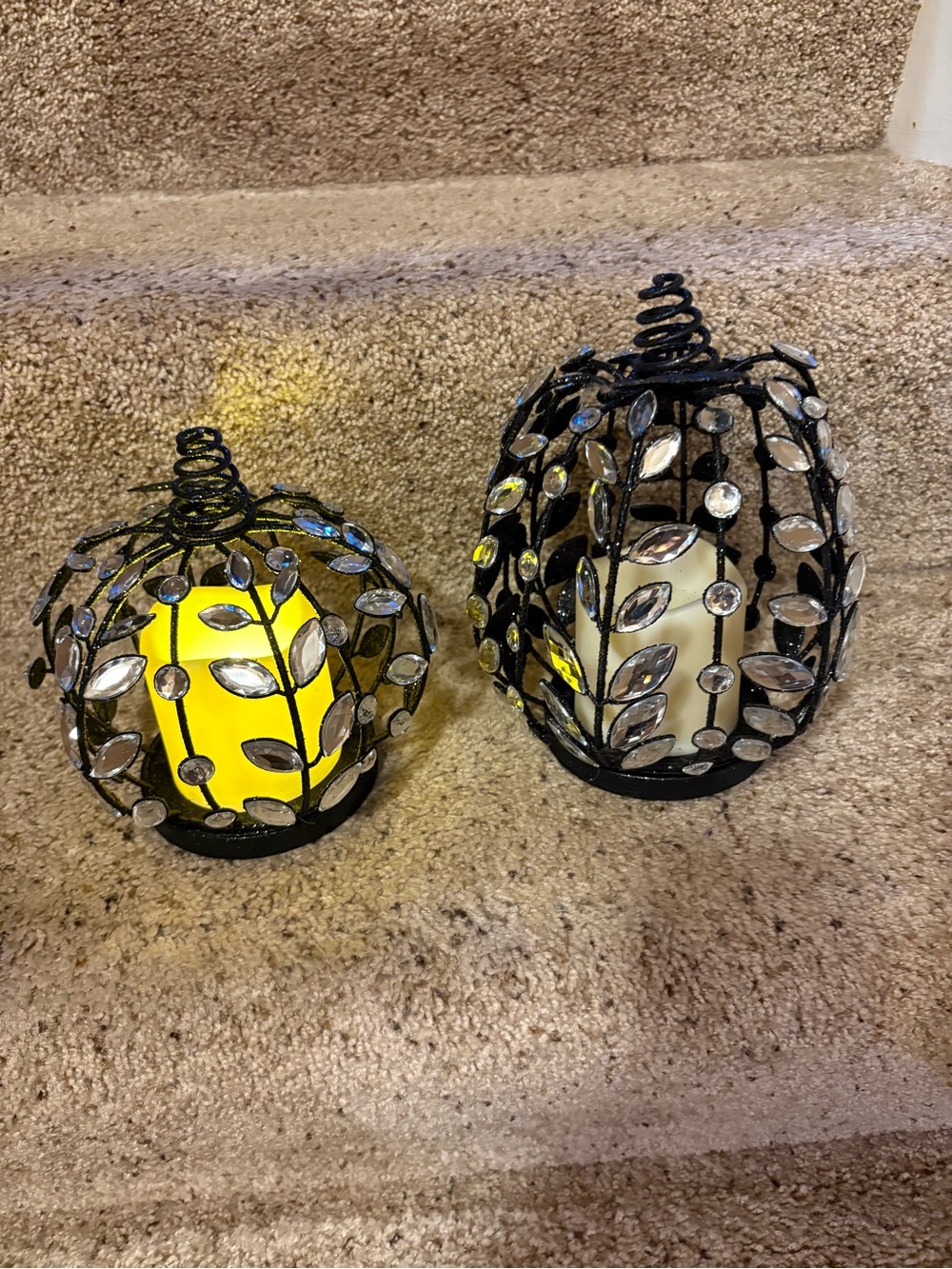 Two black glitter and gem pumpkins with b/o timer candle.